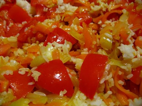 Tasty pilaf from rice, pepper and tomatoes