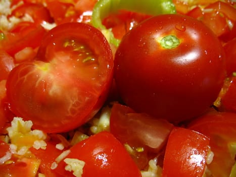 Fresh tomatoes on a background of pilaf from rice