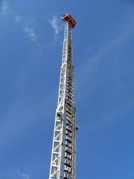Very high metal fire ladder on a background of blue sky