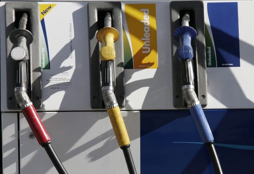 Three Petrol Pumps, Red, Yellow, Blue