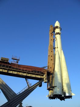 Beautiful rocket on pedestal on a background of blue sky