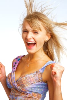 Shouting blond woman with hair flying on white background