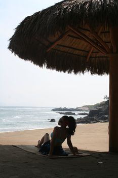 Young latin woman by ocean