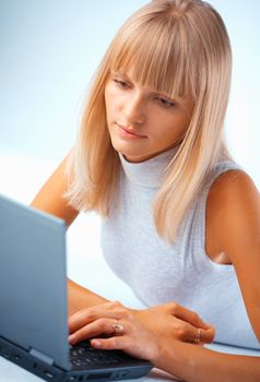 Young and beautiful woman working with laptop
