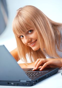 Closeup portrait of a woman with laptop