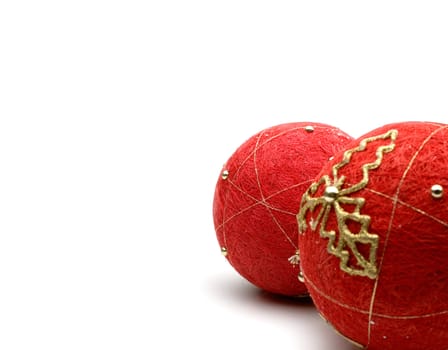 A closeup portrait of red christmas balls on white background.