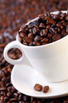 Coffee beans in a cup. Selective focus