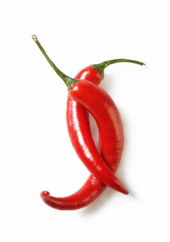 Perfectly fresh red hot peppers on white.  The file includes a clipping path.  Professionally retouched high quality image.