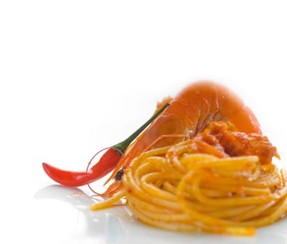 italian spaghetti pasta and fresh spicy shrimps sauce over white