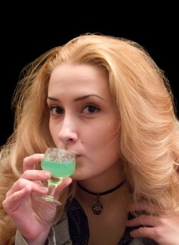 The long-haired girl with a wine-glass of absinthe liqueur