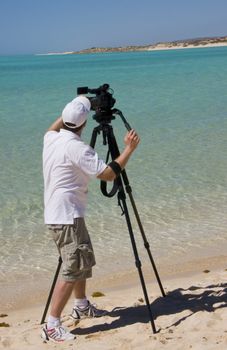 Videographer on the beach.