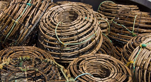 A pile of lobster pots sit on the deck of a boat on the North West coast of Tasmania.
