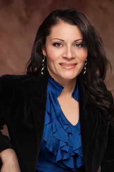 Attractive Hispanic Woman Poses for an Inside Studio Portrait.