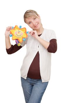 Smiling woman holding sunny toy over white