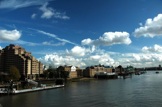 London river Thames with nice blue sky, white clouds and building