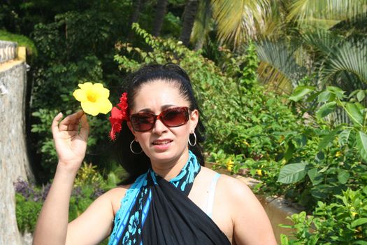 Young Latin woman at tropical setting