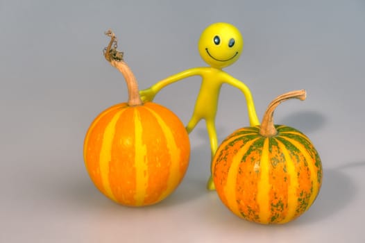 Conceptual photo of the person with two pumpkins