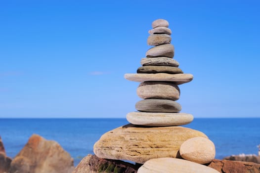 Tower of sandstone on the background of the sky and sea