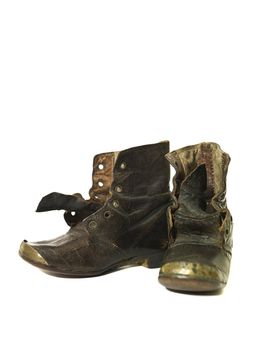 Worn vintage shoes isolated on white background