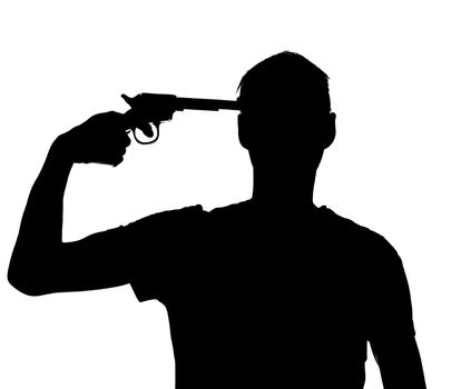Silhouette of a man with a gun against his head