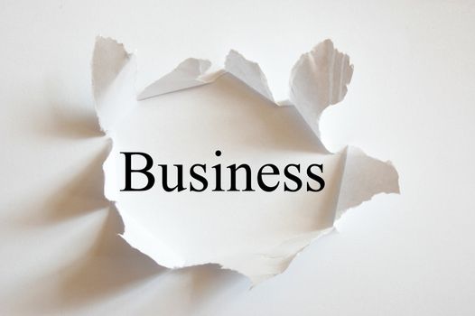 business concept with hole in white paper