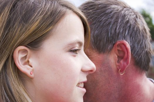 Young girl shares a special moment with her dad.