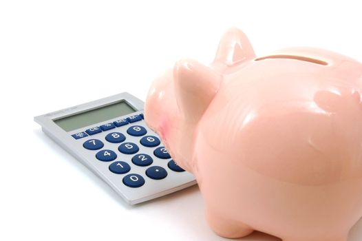 piggy bank and calculator showing saving concept