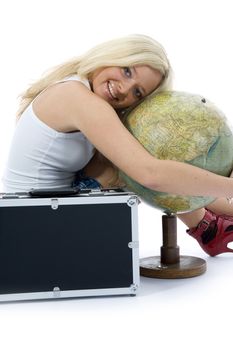 Beautiful blonde with valise and globe on isolated background