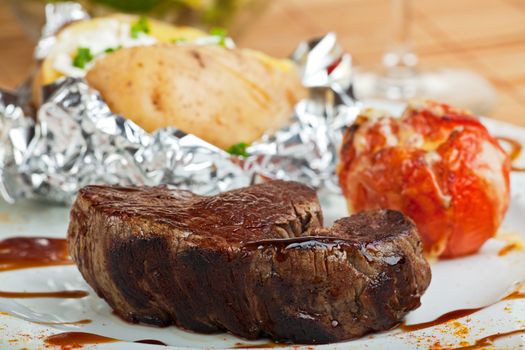 grilled steak with baked potato