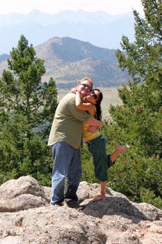 Romantic Young Couple in the Mountains