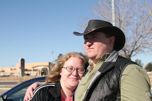 Young man and woman hug