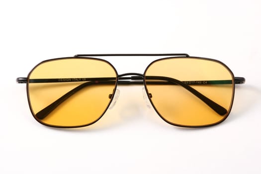 Yellow glasses in a black frame, problem spectacles