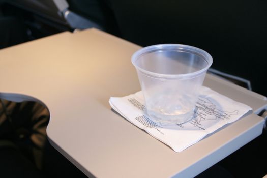 Food and snack tray open with drink on napkin