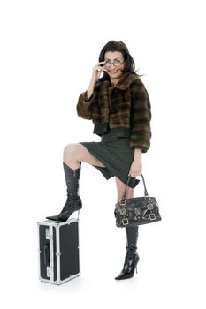 Young woman with  suitcase on  isolated background