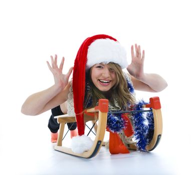 Beautiful  young woman on sledge on isolated background