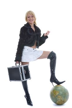 Beautiful blonde with valise and globe on isolated background