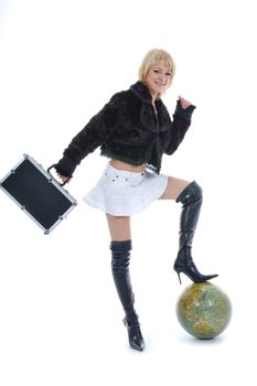 Beautiful blonde with valise and globe on isolated background