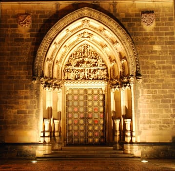 Illuminated portal of a czech cathedral on Vysehrad in the night