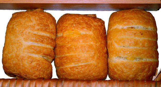 Plate of festive sausage rolls in the pastry shop