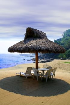small beach cabana next to sea shore