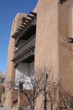 Adobe style building with wood beams