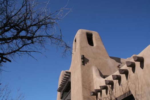 Adobe style building with wood beams