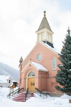Old church in the mountains with lots of snow
