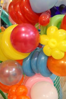 colorful balloons for sale inside a shopping mall
