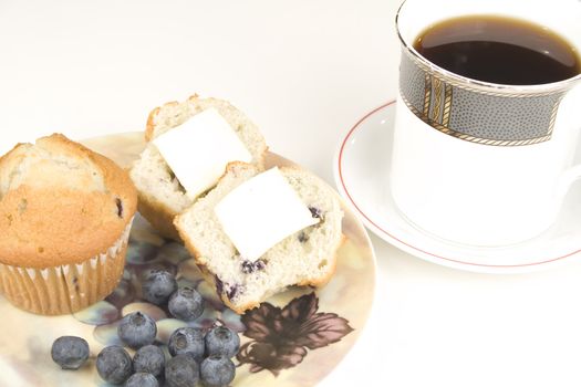 blueberry muffins with cup of coffee