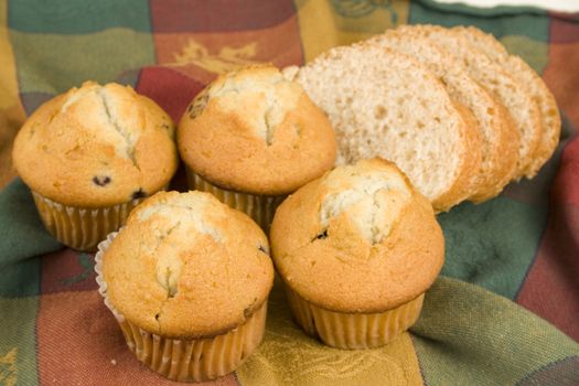 Bread and muffins on nice table cloth