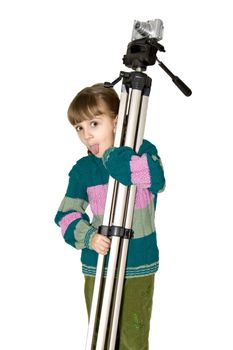 The girl holds a phototripod on a shoulder.