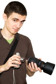 The photographer tries on an objective to a camera
