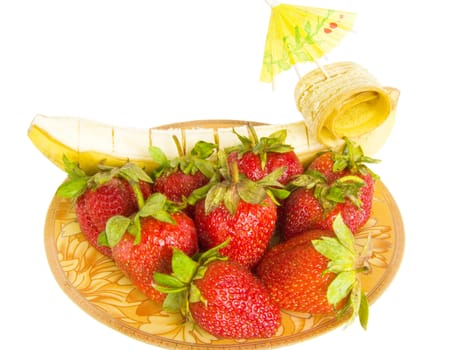 dessert set from a strawberry, banana, decorated an umbrella 