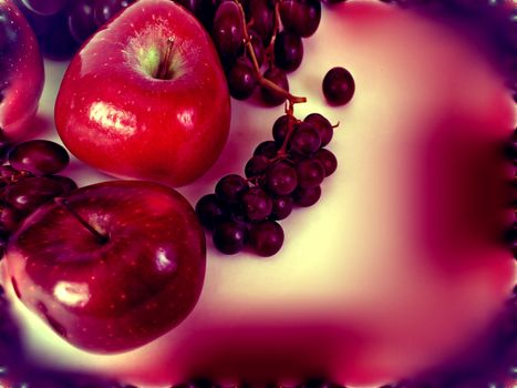 Psychedelic abstract of apples and grapes with an enhanced red aura.